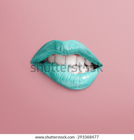 mint lips of chewing mouth on a pink background. Separated lips