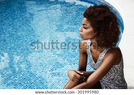 beauty woman in octail dress in pool party