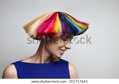 woman shake her rainbow color hair