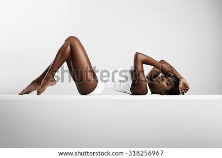 beauty woman in body suit posing and showing perfect body