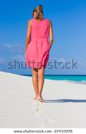 A young woman goes on a coastline