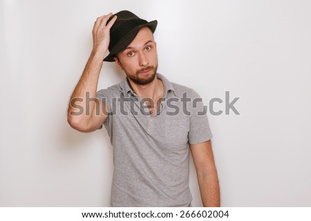 emotions Surprised guy takes off his hat