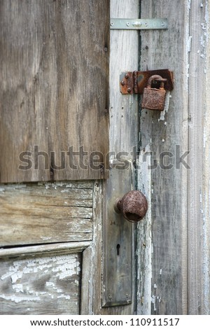 detail, dilapidated barn door, rusty door knob hinge and lock