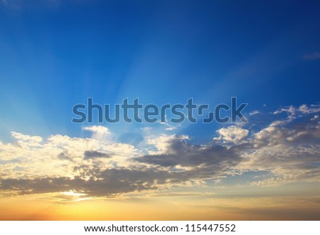 Yellow blue sunset sky with sunlight