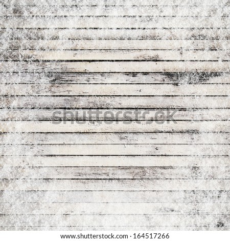 Old frozen timber texture in snow