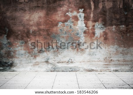 Street of empty grunge dark red wall in shadow