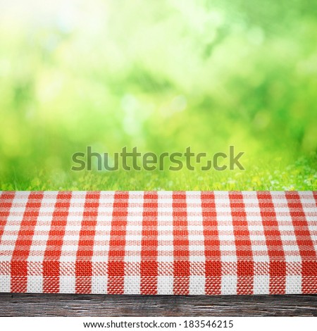 Table cloth and on table for picnic and  sunny summer nature background