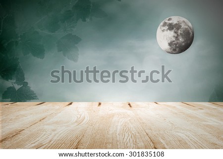 Moonlight in the meadow and wooden table