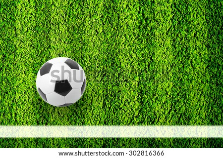 Natural green football field background with ball near the line