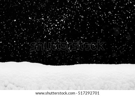 Snowdrift  and flying snow isolated over black, winter season
