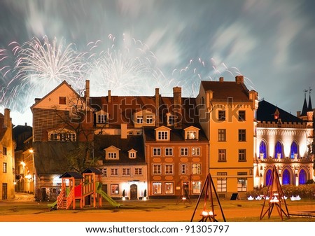Livu square in the center of Riga city with fireworks on night sky