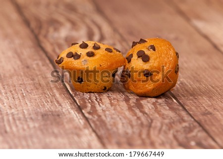 Chocolate Chip Mini Muffins on a rustic background