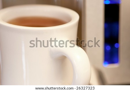 Single Serving Automatic Coffee Maker, focus on the mug handle