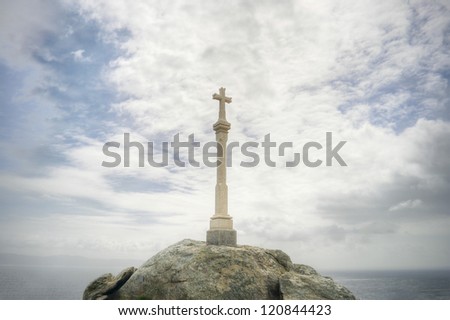 Christian Cross against the sea and the sky . Religious symbol.