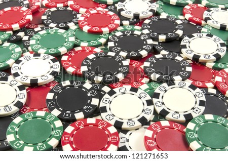 Poker chips background with red, black, green, white chips