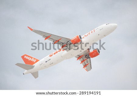 TENERIFE, SPAIN - JUNE 3:Easy Jet Airbus A320-200 taking off from Tenerife south airport on a cloudy day on June 3, 2015 in tenerife, Spain. EasyJet operate a fleet of 199 aircraft to 134 destinations