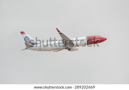 TENERIFE, SPAIN - JUNE 3:A Norwegian Boeing 737 taking off from Tenerife south airport on a cloudy day on June, 03 2015 in Tenerife, Spain. Norwegian is a low-cost carrier, which operates 66 aircraft.