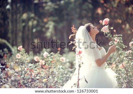 Beautiful Bride smell the roses Wedding theme with flowers Beautiful Bride smell the roses Wedding theme with flowers