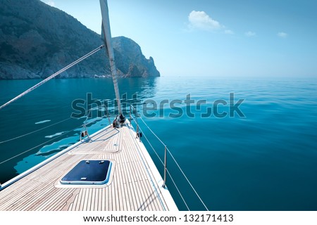 boat floats near the shore. Luxury Lifestyle