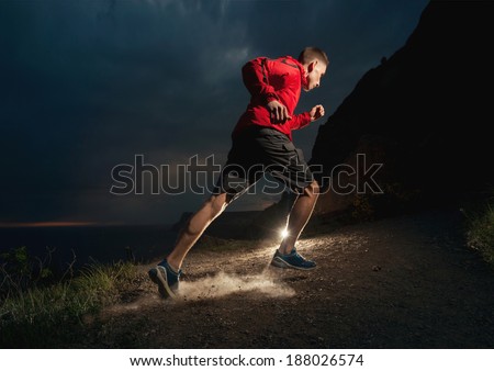 Man running in the mountains at night