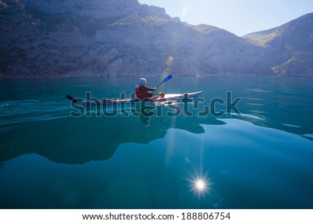 Kayak. People kayaking in the sea. Leisure activities on the calm blue water.