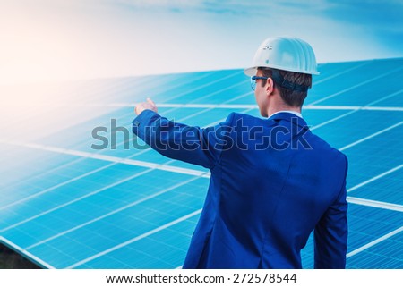 Worker solar station show photovoltaic panels. Renewable energy sources.