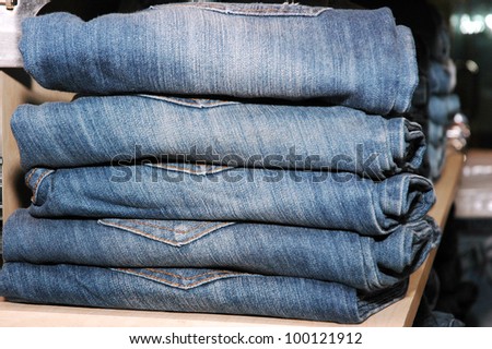 pile of jeans in the store