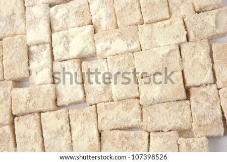 pattern of sweet pastries sprinkled with powdered milk