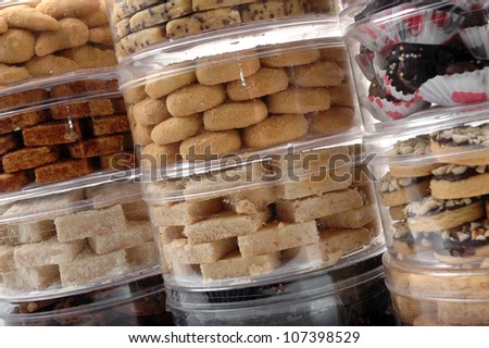 stack of various kinds of pastries in a transparent jar packaging