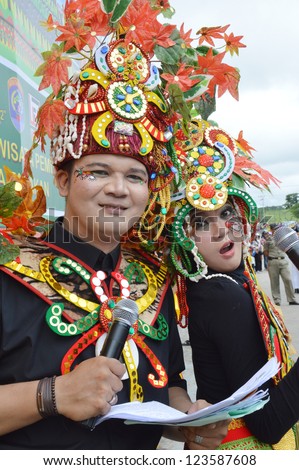 TARAKAN, INDONESIA - DEC 23, 2012 : couple master of ceremony with combined traditional dress in celebration 2nd Tarakan Cultural Carnival on Dec 23, 2012  in Tarakan, Indonesia