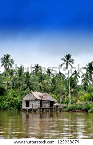 an old house on the banks of the river in rural areas