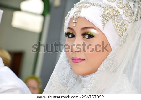 Indonesian bridal couples were undergoing the marriage ceremony event