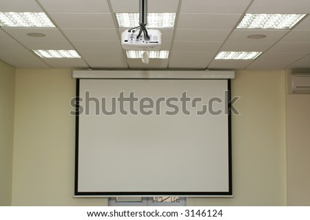 Projection screen in the boardroom with overhead projector in office