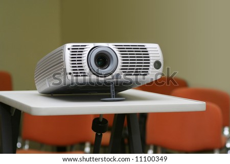 Projector on stand ready for presentation at office