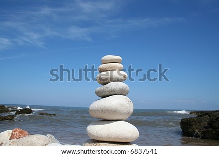zen-like stones over a beautiful landscape