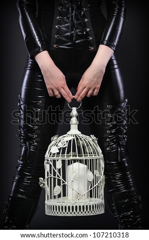 Latex woman with cage