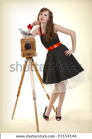 Pin-up girl and vintage camera