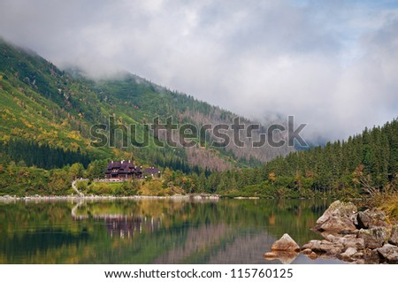 Wooden house in the forest near the lake