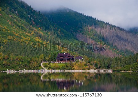 Wooden house in the forest near the lake