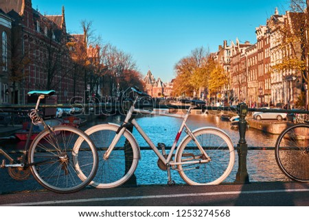 Bicycle on the bridge in Amsterdam in the autumn