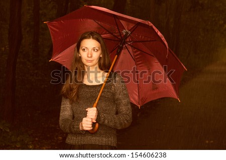 the girl with an umbrella in the rain