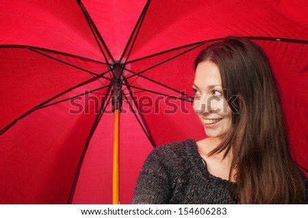 happy woman on a red umbrella