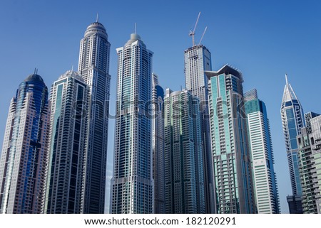 DUBAI, UAE - 3 MARCH, 2014: Modern skyscrapers in Dubai Marina, close up, in Dubai, UAE. Here is the tallest residential building in the world. March  3, 2014 Dubai, UAE.
