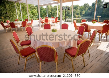 tables and chairs in the restaurant outdoors