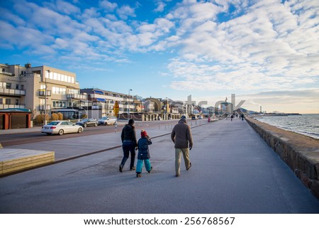 HELSINGBORG, SWEDEN - DECEMBER 26: People walk along the waterfront of the city. December 26, 2014. Helsingborg, Sweden.