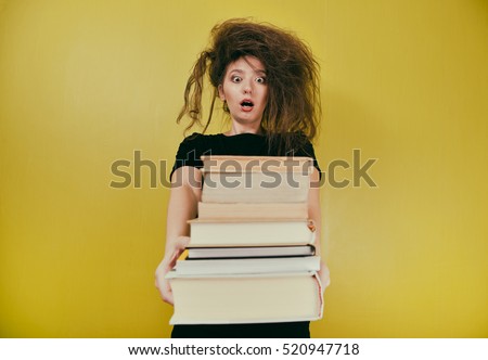 girl with a strange hair style and  books