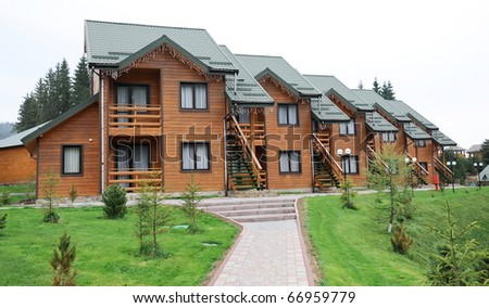 hotel complex, wood with a green roof