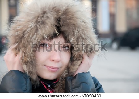 girl frozen in a cap with fur