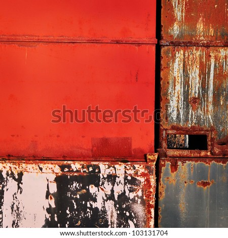 Red metal wall texture, industrial background.
