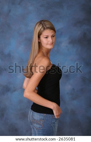 stock photo Girl Looking Down in Tight Jeans